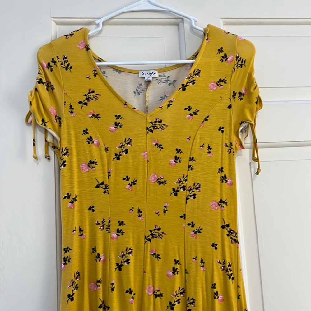A short yellow dress from the brand love, fire